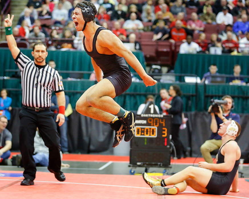 Third Place, Photographer of the Year - Large Market - Andy Morrison / The (Toledo) BladeCasey Sparkman of Massilon Perry reacts after scoring the winning takedown in overtime to defeat number one ranked Perrysburg wrestler J.P. Newton in their Division I 152-pound match during the championship semi-final round of the 77th Annual State Wrestling Individual Tournament at the Ohio State University in Columbus, Friday.