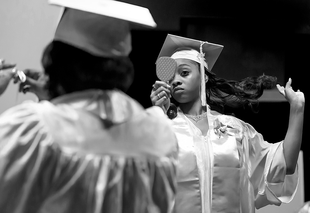 Third Place, Photographer of the Year - Large Market - Andy Morrison / The (Toledo) BladeCre'Ana Bell checks her hair before the 10th Annual Commencement Exercises for Polly Fox Academy at Cedar Creek Church.