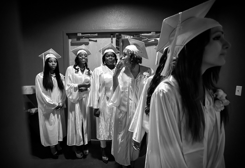 Third Place, Photographer of the Year - Large Market - Andy Morrison / The (Toledo) BladeJay'via Badgett, left, Cre'Ana Bell, LaChela Benton, Alexis Brown and Rocio Gonzalez, right, line up for the 10th Annual Commencement Exercises for Polly Fox Academy at Cedar Creek Church.  Sixteen girls received their diplomas. 