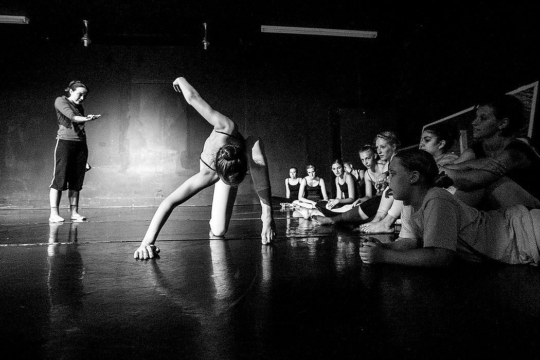 First Place, Photographer of the Year - Small Market - Jessica Phelps / Newark AdvocateAssistant artistic director, Erika Twining Wills, points at Madison Weisend, 16, as she demonstrates a modern dance move to other CYOB dancers in a workshop just days before "The Nutcracker" auditions. 