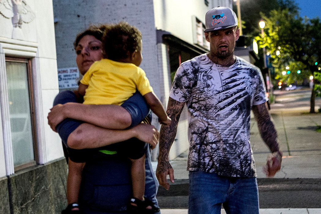 First Place, Photographer of the Year - Small Market - Jessica Phelps / Newark AdvocateMichele embraces her son and walks angrily away from her boyfriend, Travis, who had been watching her son during a narcotics anonymous meeting. The couple were both in the meeting but Travis who is also a recovering addict took her son outside because he was disrupting the meeting. Michele in turn had become very worried when she could not find them right away. 