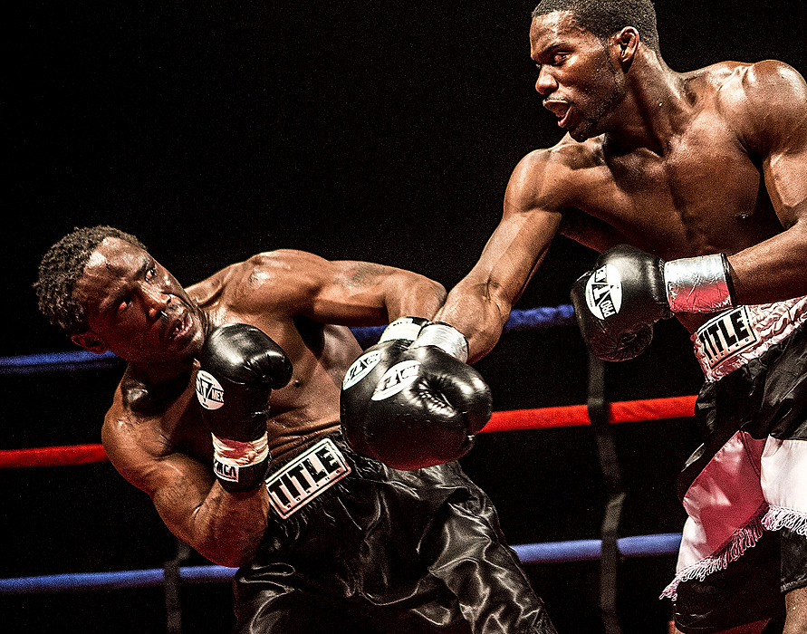 First Place, Photographer of the Year - Small Market - Jessica Phelps / Newark AdvocateAnthony Woods dodges a punch from Bryan Goldsby  in the super welterweight class. Goldsby won the match. 