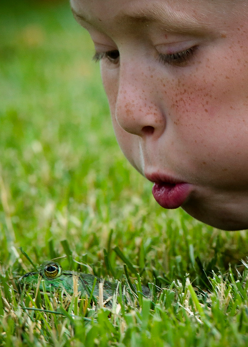 Second Place, Photographer of the Year - Small Market - Joshua A. Bickel / ThisWeek Community NewsKent Parton, 9, blows on his frog while trying to motivate him to jump during the Dublin Kiwanis Frog Jump June 28, 2014 at Coffman Park in Dublin. During the jump, contestants start at the center of a ring and the first frog to exit the ring is declared winner. Contestants may use any method of motivation to get their frog to jump, except touching.