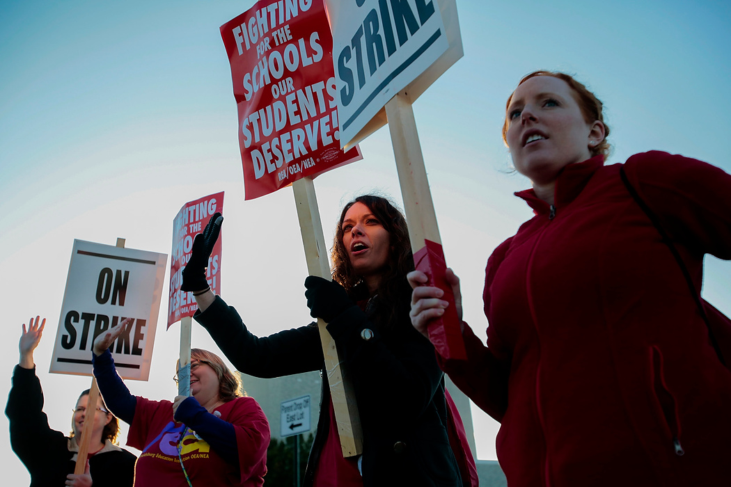 Second Place, Photographer of the Year - Small Market - Joshua A. Bickel / ThisWeek Community NewsReynoldsburg High School teachers, who declined to give their names, form a picket line outside Reynoldsburg High School. Teachers in the district went on a 15-day strike to protest a new contract which failed to address overcrowding in classrooms. 