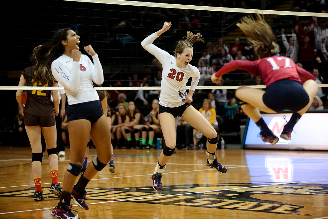 Second Place, Photographer of the Year - Small Market - Joshua A. Bickel / ThisWeek Community NewsBishop Hartley middle hitter Madeline Brandewie (20) celebrates a point late in the fifth set of the Hawks' Division II volleyball state semifinal against Kettering Archbishop Alter at the Nutter Center in Fairborn. Hartley defeated Alter in five sets, 20-25, 25-19, 25-20, 25-19, 15-7. Brandewie had a team-high 21 kills.