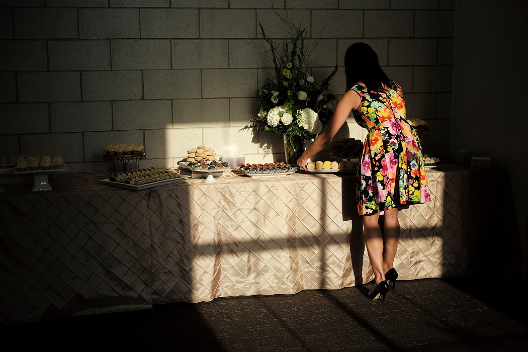 Second Place, Photographer of the Year - Small Market - Joshua A. Bickel / ThisWeek Community NewsEvent manager Regan Mezak places a plate of pastries for guests during the Installation Ceremony for Jennifer Ciccarelli, the 13th Head of School at Columbus School for Girls in Bexley.