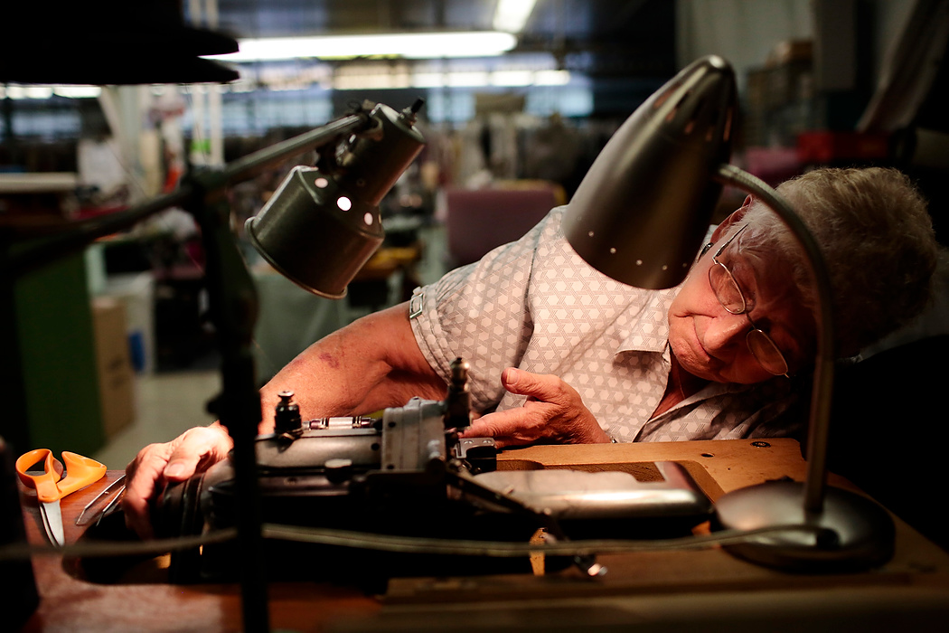 Second Place, Photographer of the Year - Small Market - Joshua A. Bickel / ThisWeek Community NewsMary Anders, 75, of Grove City, tries to set her thread in an old Singer sewing maching while working at Caskey's Dry Cleaning Company in German Village in Columbus. Anders has worked at the company since age 17, when she started a part-time job in the company's warehouse. 