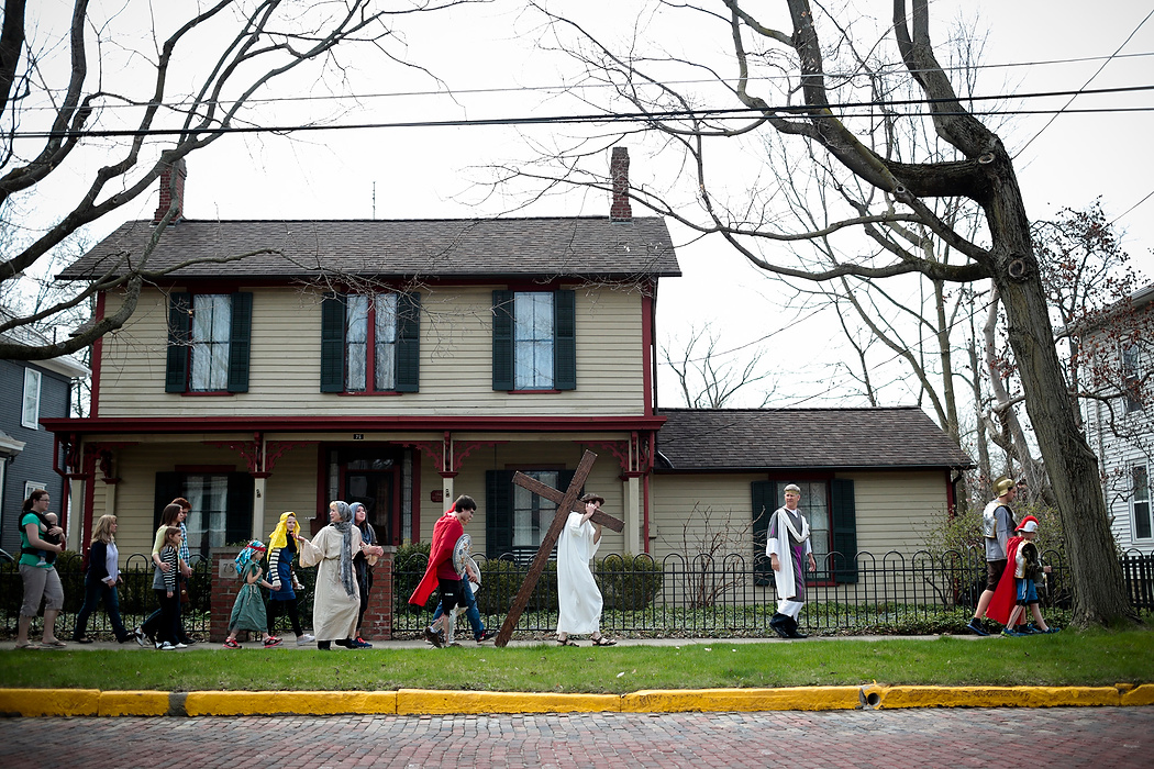 Second Place, Photographer of the Year - Small Market - Joshua A. Bickel / ThisWeek Community NewsGary Leimbach, as Jesus, carries a crucifix up College Avenue during the annual Good Friday "Cross Walk"  in Westerville.