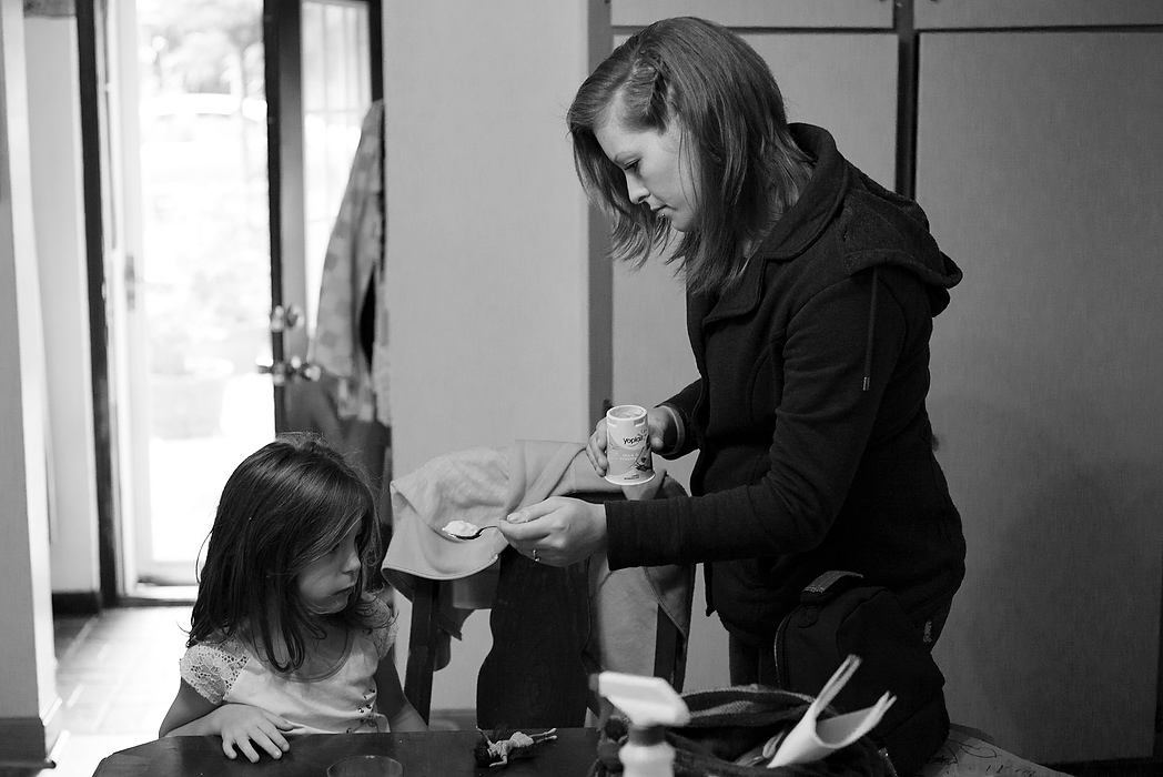 Second Place, Photographer of the Year - Small Market - Joshua A. Bickel / ThisWeek Community NewsBrittany tries to get Kalysta to eat some yogurt for breakfast  in Reynoldsburg. Kalysta has ADHD and her medication suppresses her appetite. Brittany constantly tries to get Kalysta to eat. 