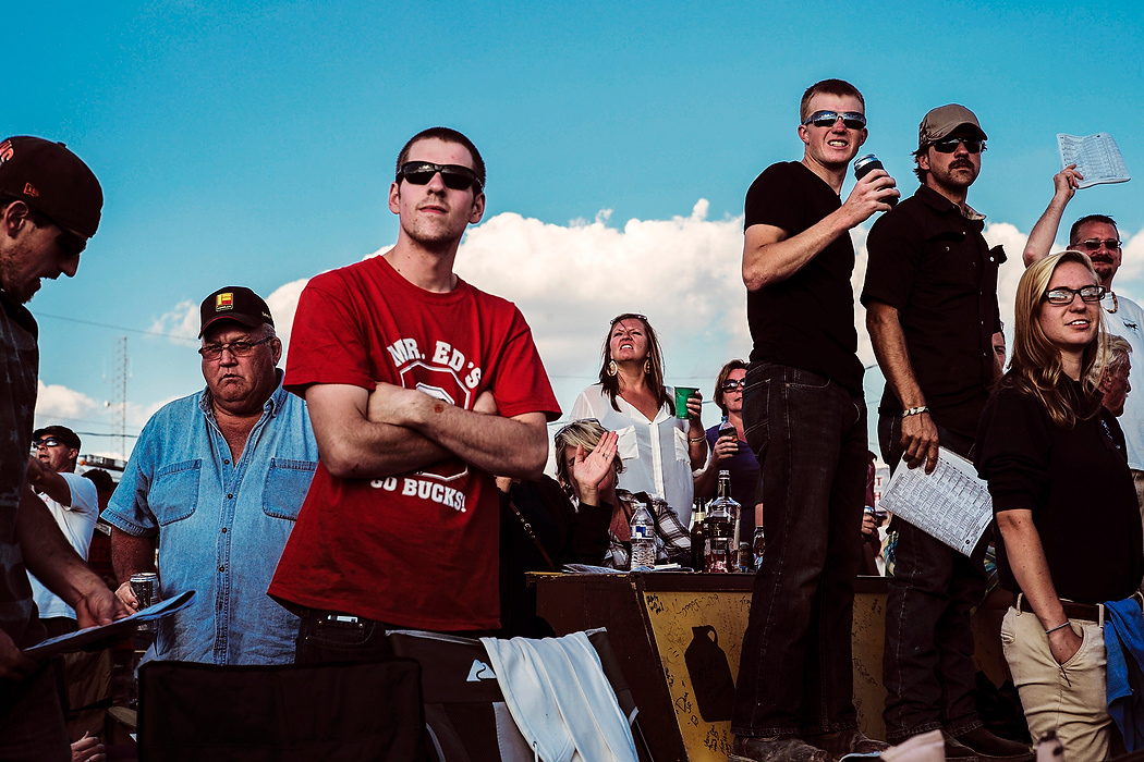 Second Place, Photographer of the Year - Small Market - Joshua A. Bickel / ThisWeek Community NewsSpectators react as drivers make a turn during an elimination race at the Little Brown Jug  at the Delaware County Fairgrounds.