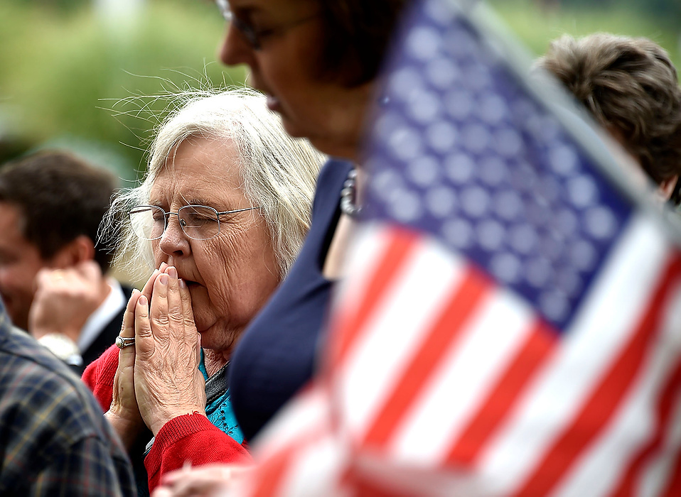 Third Place, Photographer of the Year - Small Market - Bill Lackey / Springfield News-SunMaryln Sundberg says a prayer for the country along with other Clark County residents and officials during a public prayer on the lawn in front of the Clark County Common Pleas Courthouse. Several dozen residents gathered together on the anniversary of the Sept. 11 terrorist attacks to pray the country and its citizens.