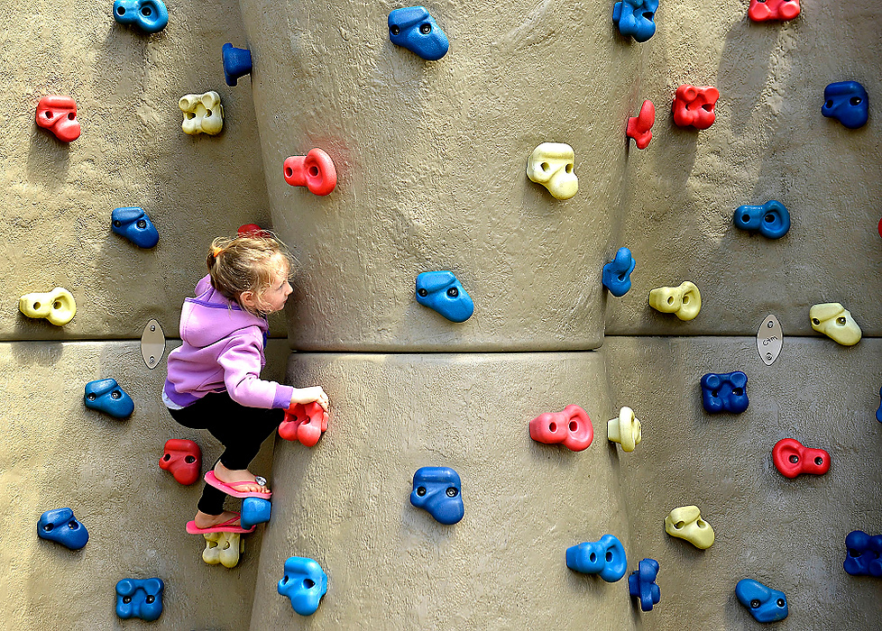 Third Place, Photographer of the Year - Small Market - Bill Lackey / Springfield News-SunAddison Paciorek, 5, was enjoying the mild weather by practicing her rock climbing skills on the colorful climbing wall at Moorefield Family Park.
