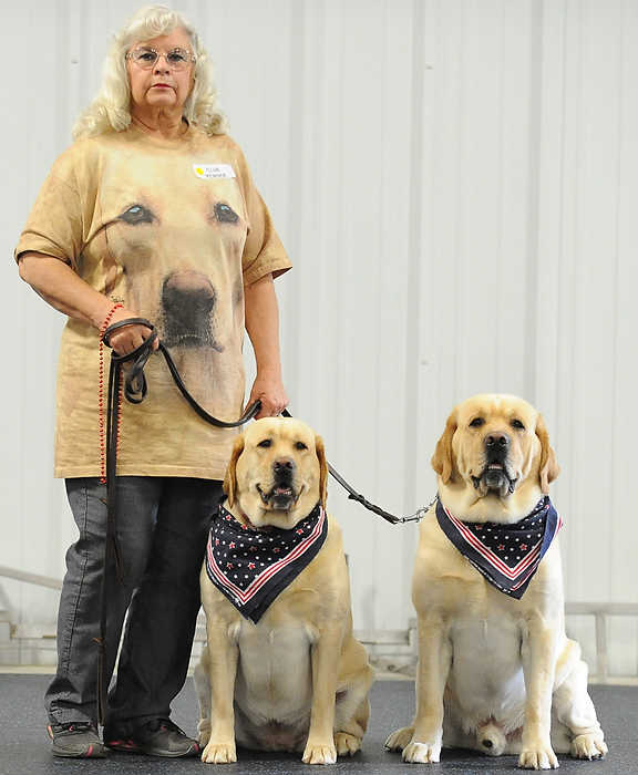 Award of Excellence, Portrait Personality - David Dermer / Kent State UniversityPatsy Catalano of Newton Falls stands with her Labrador Retriever Vinnie and Vita during the Youngstown All Breed Training Club open house.