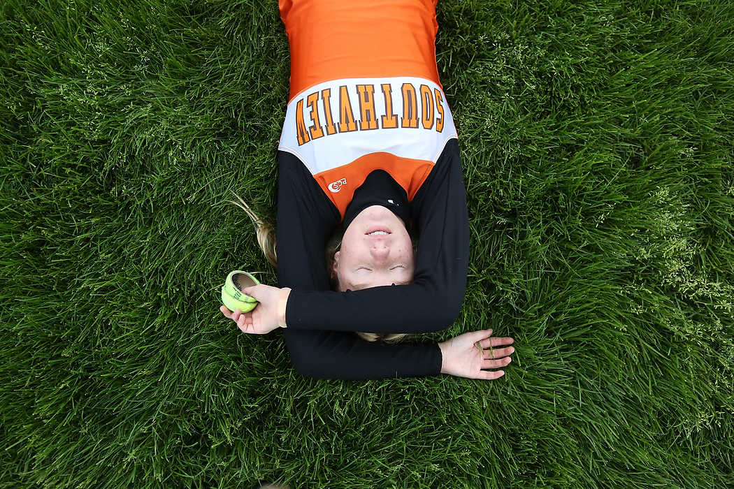 Third Place, Sports Feature - Katie Rausch / The (Toledo) BladeSouthview's freshman Helen Waldie catches her breath after running with three other teammates in the four by 200 meter relay during the Northern Lakes League track and field championship meet at Maumee High School. Southview's team won the relay. The tennis ball halves Miss Waldie held are used to mark runner position on the track.  