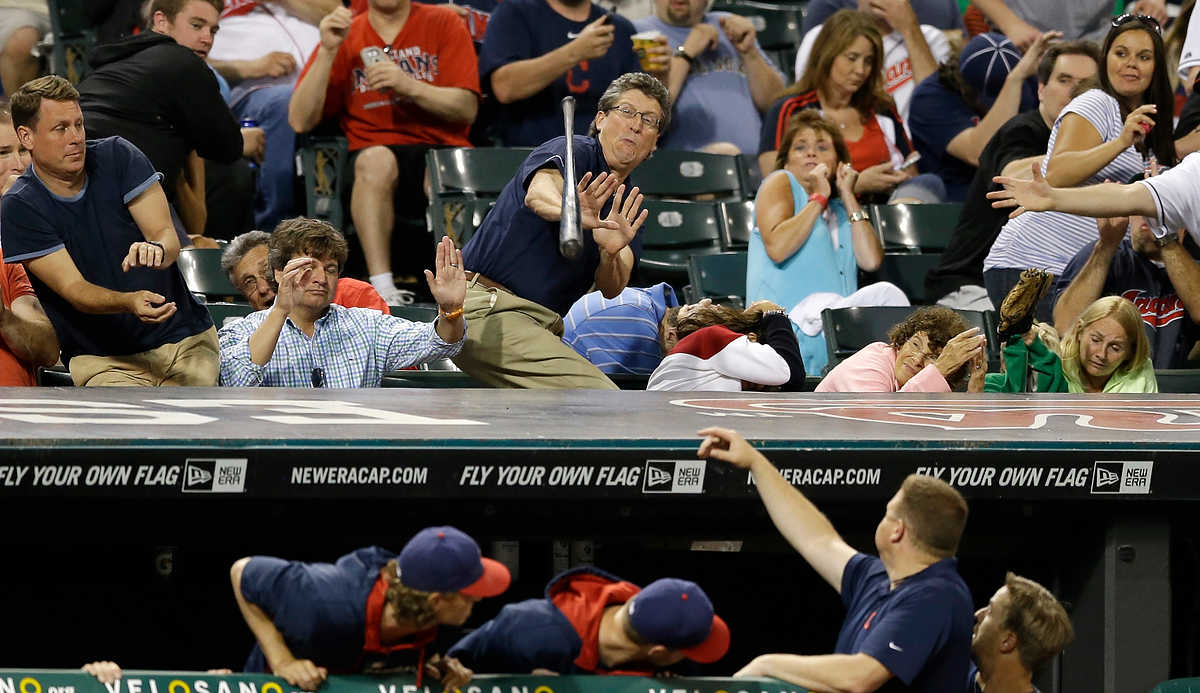 Award of Excellence, Sports Feature - Tony Dejak / Associated PressFans try to dodge a bat that came loose from the hands of Cleveland Indians' Asdrubal Cabrera in the seventh inning of a game against the Boston Red Sox.