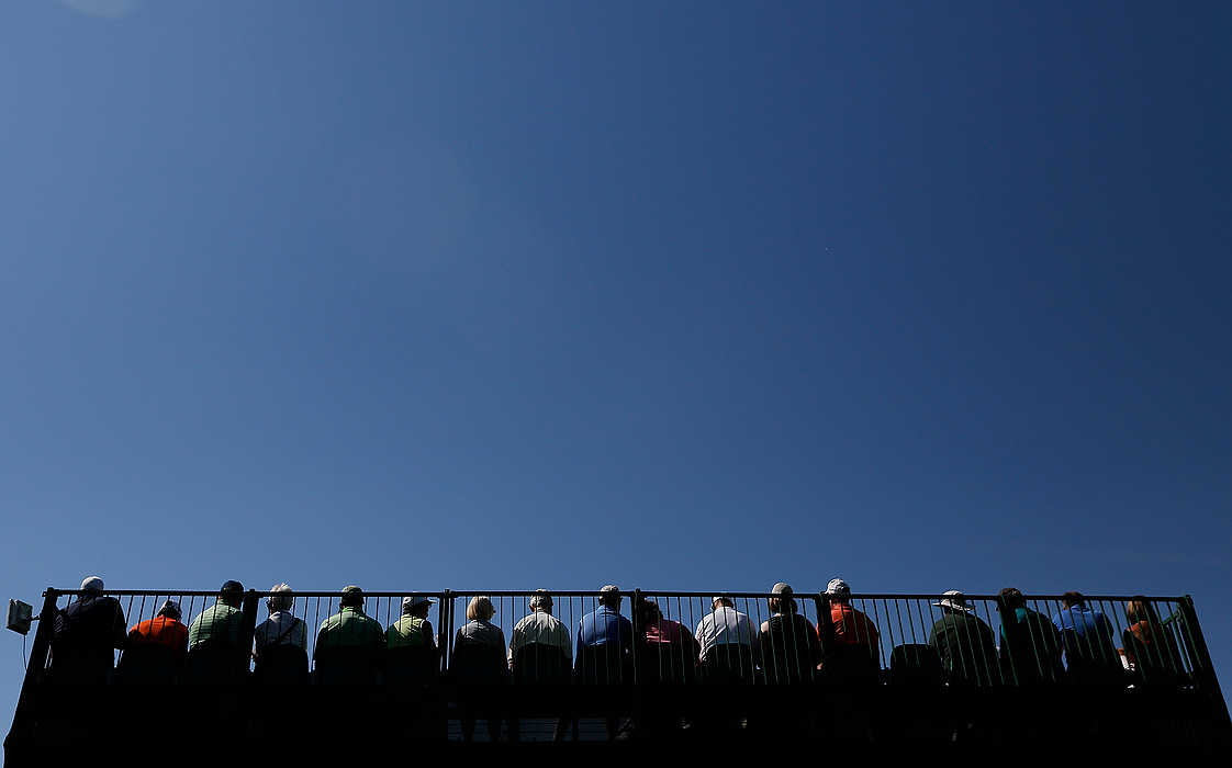 First Place, Ron Kuntz Sports Photographer of the Year - Eamon Queeney / The Columbus DispatchGolf fans watch the 14th green from the top of a set of risers during the second round of the Memorial Tournament at Muirfield Village Golf Club in Dublin. Paul Casey leads after the second round with a two-day score of 12 under par. 