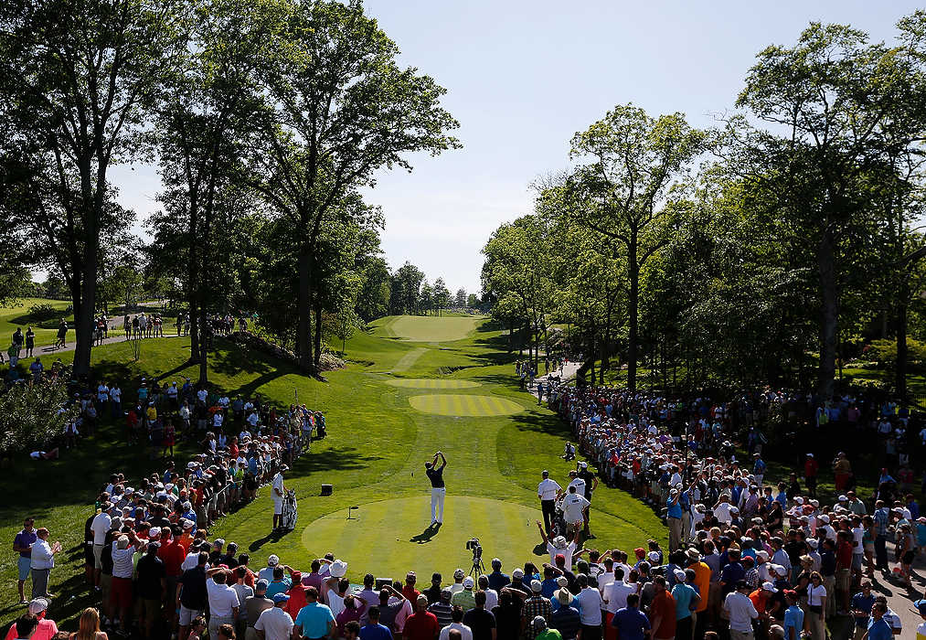 First Place, Ron Kuntz Sports Photographer of the Year - Eamon Queeney / The Columbus DispatchBubba Watson hits a tee shot on the 15th hole surrounded by fans during the second round of the Memorial Tournament at Muirfield Village Golf Club in Dublin. Paul Casey leads after the second round with a two-day score of 12 under par. 