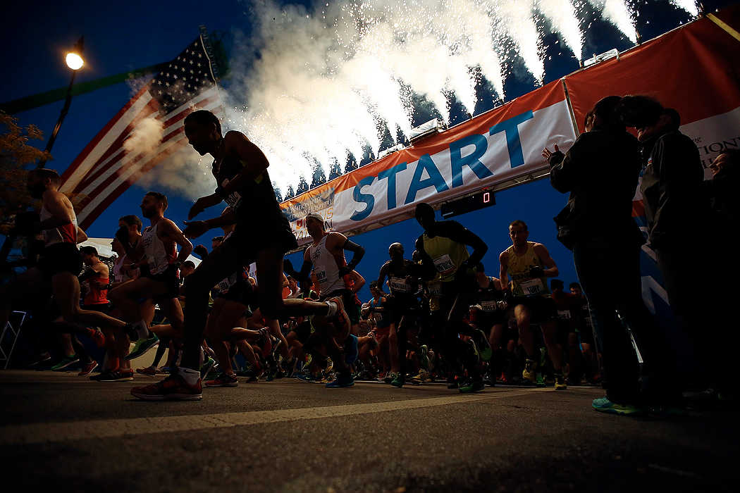 First Place, Ron Kuntz Sports Photographer of the Year - Eamon Queeney / The Columbus DispatchFireworks shoot into the air as the very first runners cross the starting ling of the 35th Nationwide Children's Hospital Columbus Marathon. Almost 20,000 runners converged on Columbus to run the annual full and half marathons. 