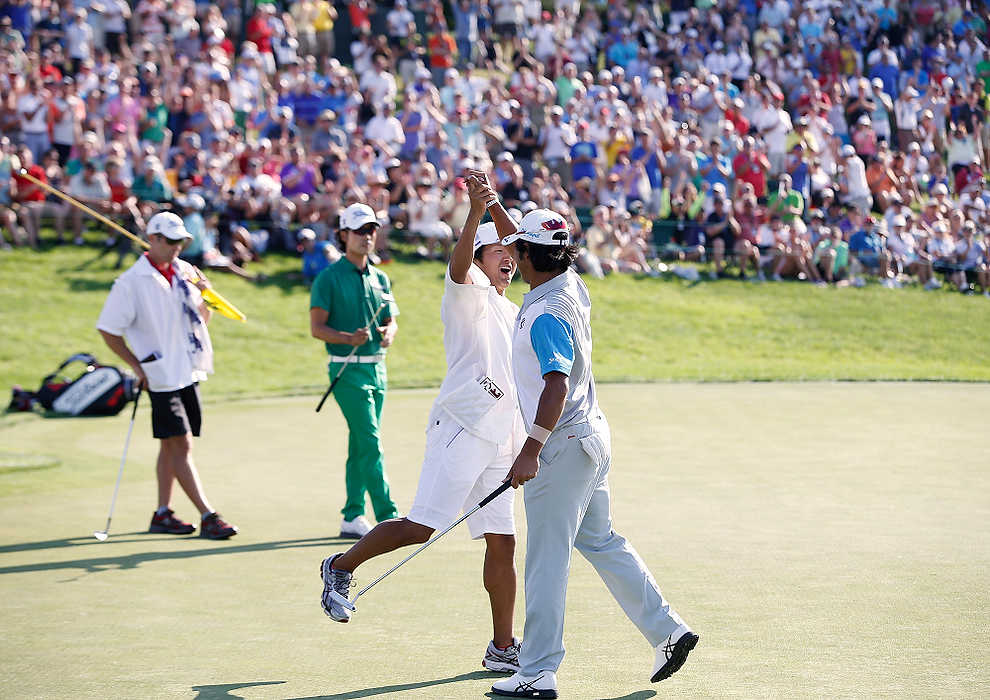 First Place, Ron Kuntz Sports Photographer of the Year - Eamon Queeney / The Columbus DispatchHideki Matsuyama (right) celebrates with his caddy Daisuke Shindo (left) on the 18th green after defeating Kevin Na in a sudden death playoff to win the final round of the Memorial Tournament at Muirfield Village Golf Club in Dublin.