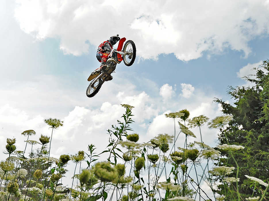 Second Place, Ron Kuntz Sports Photographer of the Year - Erik Schelkun / Elsestar ImagesMatt Williams of Troy soars over 120 ft (distance) during a training session at a private dirt track in Brookville. Williams uses the track which is owned by a friend to hone his motorcross skills. 