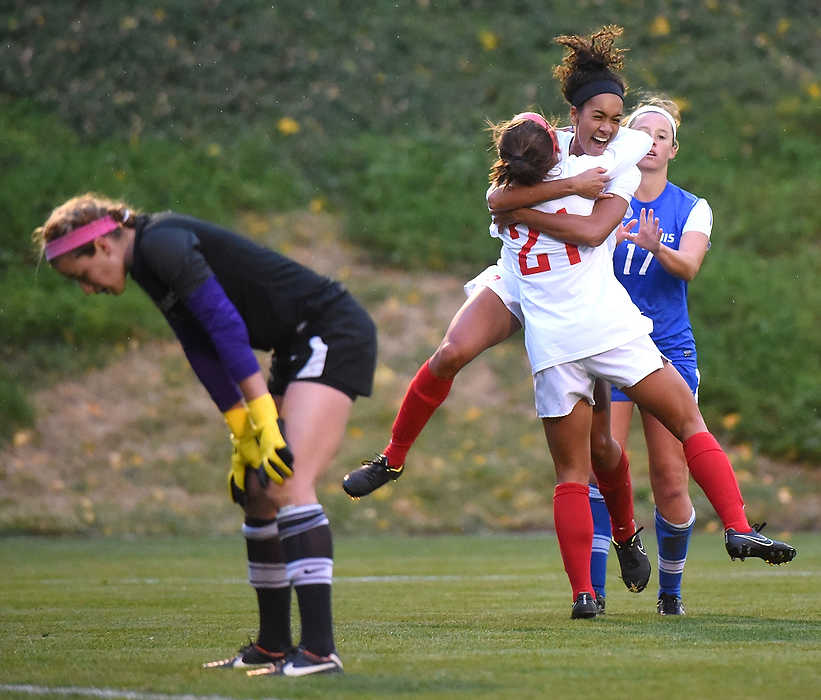 Second Place, Ron Kuntz Sports Photographer of the Year - Erik Schelkun / Elsestar ImagesDayton's Ashley Campbell hugs Meghan Blank while St. Louis's goalkeeper Hanna Benben looks on. The goal set up an overtime period where the Dayton Flyers won 3-2. 