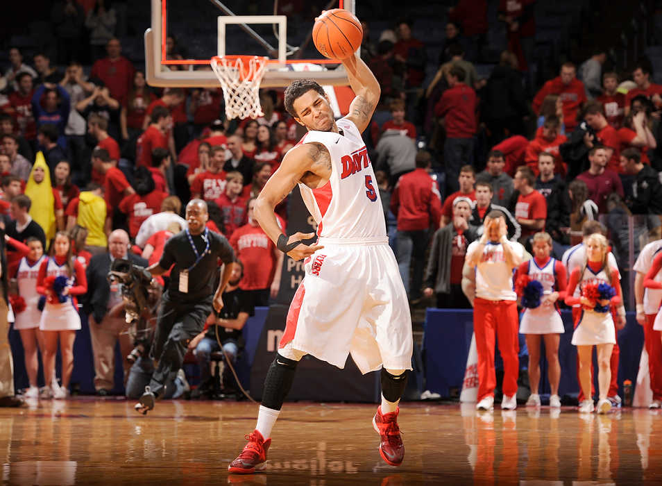 Second Place, Ron Kuntz Sports Photographer of the Year - Erik Schelkun / Elsestar ImagesDayton's Devin Oliver slams the ball in frustration after St. Joseph's Langston Galloway hits a shot at the last second to beat Dayton 60-57 at UD Arena. 