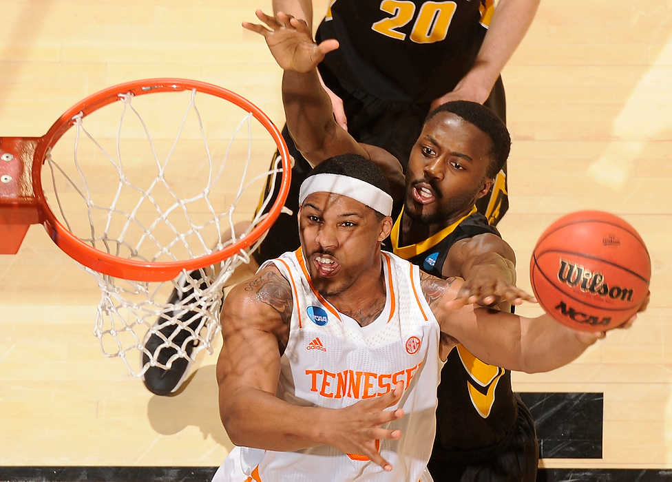 Second Place, Ron Kuntz Sports Photographer of the Year - Erik Schelkun / Elsestar ImagesTennessee's Jarnell Stokes attacks the rim for a shot over Gabriel Olaseni of Iowa during the NCAA First Four in Dayton. It took Tennessee advanced to the next round of the NCAA tournament with a 78-65 overtime victory at UD Arena in Dayton.