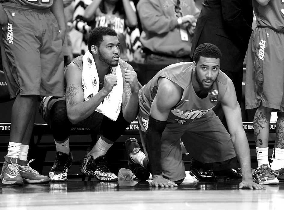 Second Place, Ron Kuntz Sports Photographer of the Year - Erik Schelkun / Elsestar ImagesJalen Robinson and Devon Scott on the edge of their seats during the final minutes of a close game against Syracuse in the NCAA Tournament in Buffalo, NY. The Flyers edged Syracuse 55-53 to advance to the sweet sixteen.