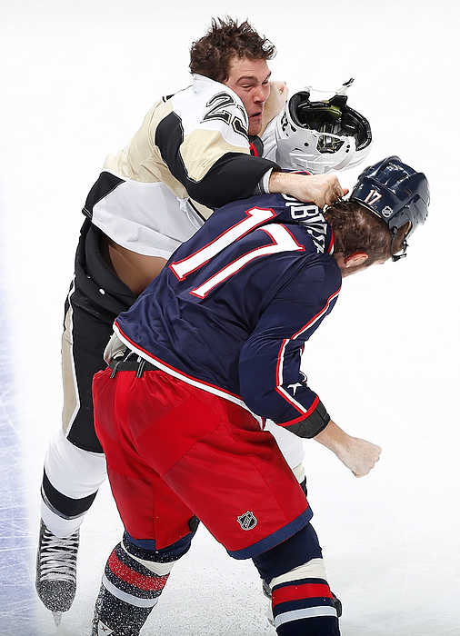 First Place, Ron Kuntz Sports Photographer of the Year - Eamon Queeney / The Columbus DispatchPittsburgh Penguins right wing Steve Downie (23) and Columbus Blue Jackets center Brandon Dubinsky (17) land punches as they fight in the second period of the NHL game between the Columbus Blue Jackets and the Pittsburgh Penguins at Nationwide Arena in Columbus. At the end of the second period the Columbus Blue Jackets were tied with the Pittsburgh Penguins 1 - 1.