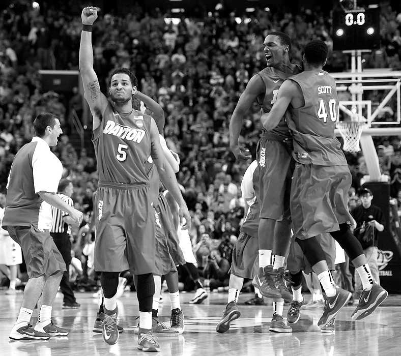 Second Place, Ron Kuntz Sports Photographer of the Year - Erik Schelkun / Elsestar ImagesThe Dayton Flyers erupt in celebration as time expires after defeating Syracuse 55-53 in Buffalo, NY to advance to the Sweet sixteen for the first time since 1984