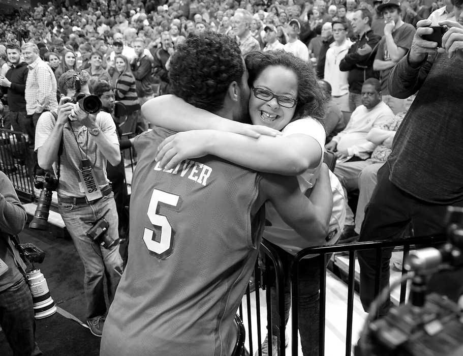 Second Place, Ron Kuntz Sports Photographer of the Year - Erik Schelkun / Elsestar ImagesDevin Oliver of Dayton Hugs his sister Maya following the Flyers win over Stanford during the NCAA tournament in Memphis. 