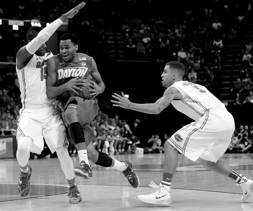 Second Place, Ron Kuntz Sports Photographer of the Year - Erik Schelkun / Elsestar ImagesVee Sanford of Dayton drives to the hoop against the Florida defense during the NCAA elite 8 match in Memphis.