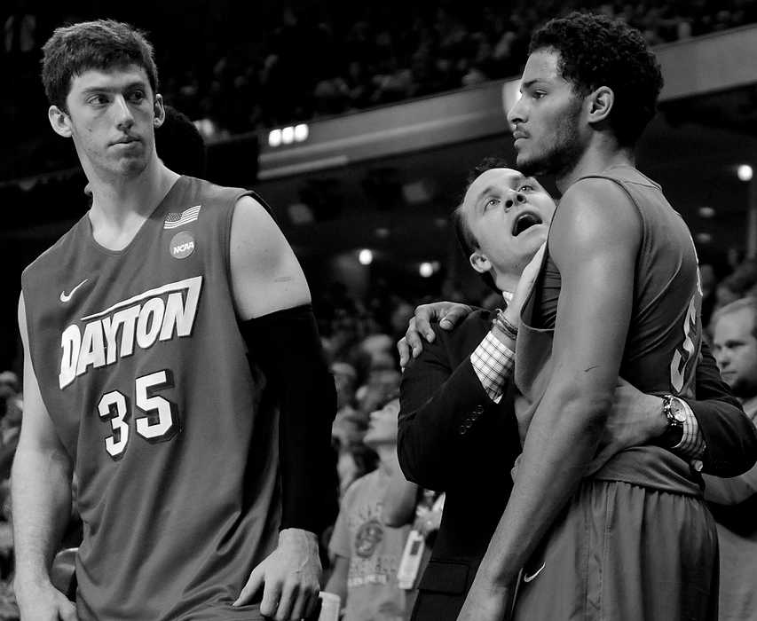 Second Place, Ron Kuntz Sports Photographer of the Year - Erik Schelkun / Elsestar ImagesCoach Eric Farrell encourages Devin Oliver late in the 2nd half against Florida when it was clear that Florida was going to end Dayton's cinderella tournament run by a final score of 62-52.