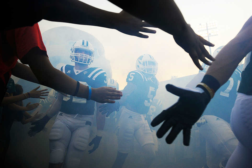 Third Place, Ron Kuntz Sports Photographer of the Year - Logan Riely / Ohio UniversityThe Ohio Bobcats take the field against Idaho for  their home opener at Peden Stadium.