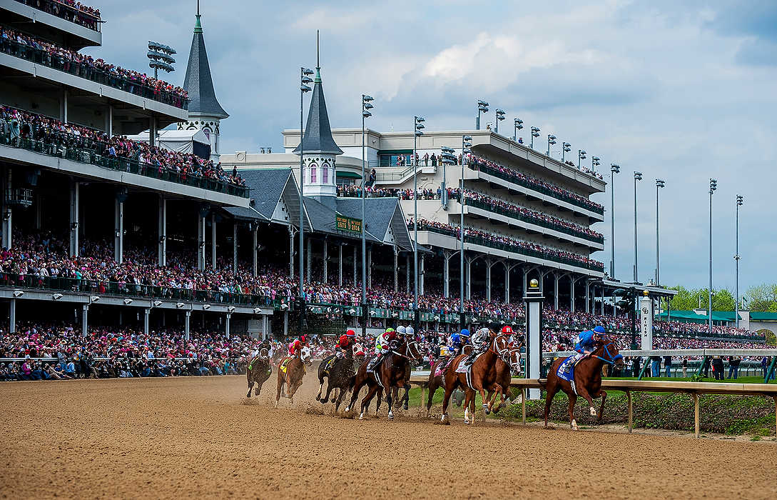 Third Place, Ron Kuntz Sports Photographer of the Year - Logan Riely / Ohio UniversityHorses fly around the first bend at Churchill Downs in front of a packed crowd during the 140th annual Kentucky Oaks race. Untappable ridden by Rosie Napravnik would eventually come out to be the winner.