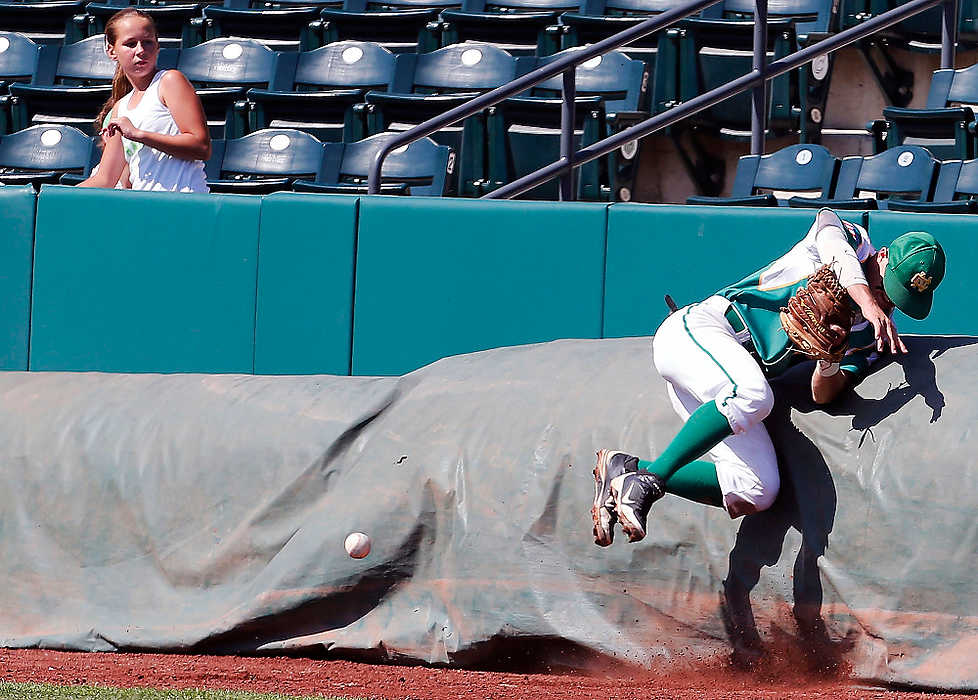 Third Place, Ron Kuntz Sports Photographer of the Year - Logan Riely / Ohio UniversityNewark Catholic Green Wave second baseman Mike Lohr goes for a ball and ends up onto the mats during the OHSAA baseball state championship finals against the Defiance Tinora Rams at Huntington Park. In the end the Green Wave fell to the Rams 3-4.