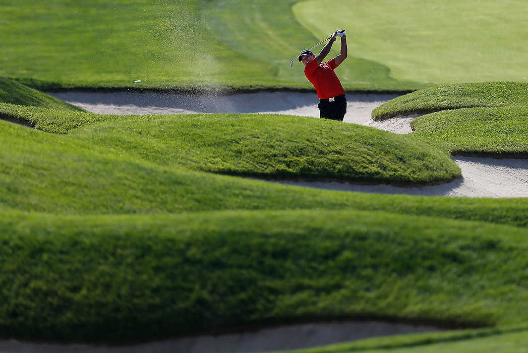 Third Place, Ron Kuntz Sports Photographer of the Year - Logan Riely / Ohio UniversityJason Day hits from the bunker on the 18th hole during the annual Memorial tournament at Muirfield Village Golf Club in Dublin.