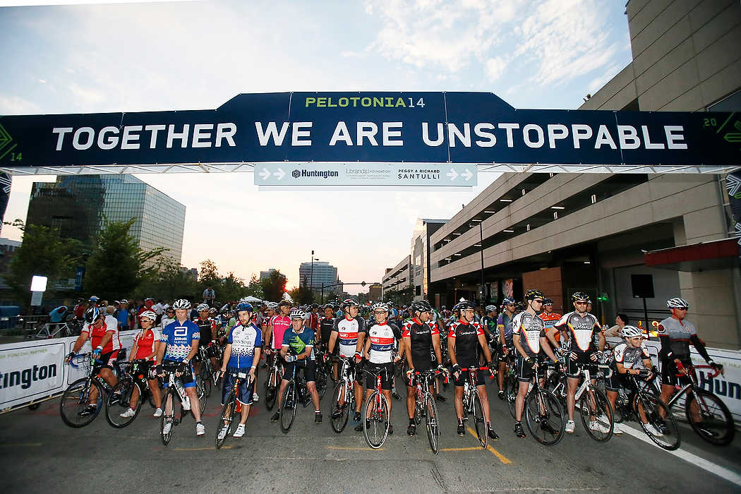 Third Place, Ron Kuntz Sports Photographer of the Year - Logan Riely / Ohio UniversityClass A riders sit at the start line moments before heading out for the 6th annual Pelotonia held in downtown Columbus. Over 7,000 cyclists ride varying distances to cure cancer. 