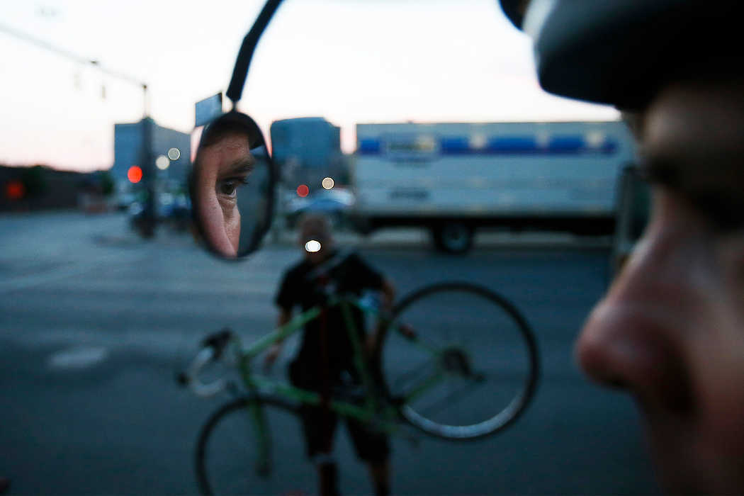 Third Place, Ron Kuntz Sports Photographer of the Year - Logan Riely / Ohio UniversityVeteran Pelotonia 180 mile rider Dan Fulton of Bexley, Ohio, prepares for his 6th Pelotonia in downtown Columbus. Over 7,000 cyclists ride varying distances to cure cancer. 
