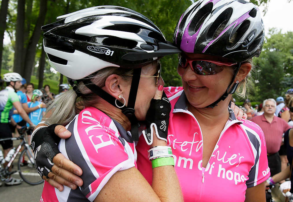 Third Place, Ron Kuntz Sports Photographer of the Year - Logan Riely / Ohio UniversityAmy Fox (left) and Chrissy Montgomery (right) both of Finley, share a moment after completing their 100 mile ride to Kenyon College during the 6th annual Pelotonia.