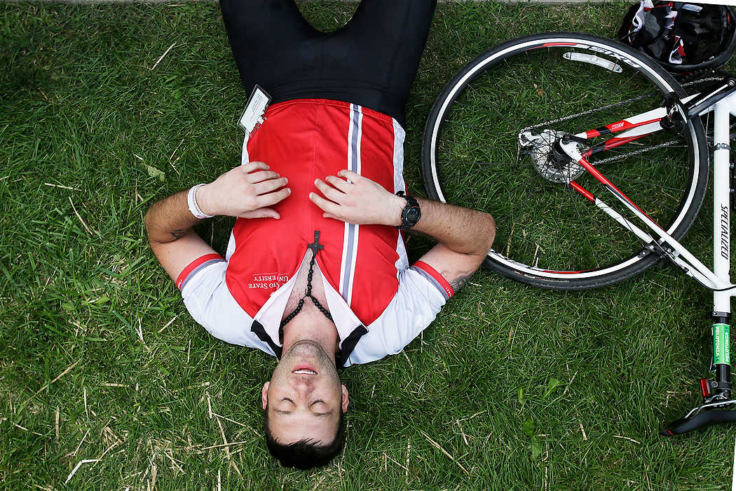 Third Place, Ron Kuntz Sports Photographer of the Year - Logan Riely / Ohio UniversityJames Ford of Columbus relaxes after completing his 100 mile journey through central Ohio where he finished outside the athletic center at Kenyon College for the 6th annual Pelotonia.