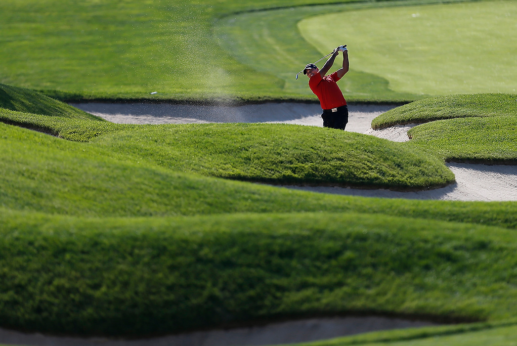 First Place, Student Photographer of the Year - Logan Riely / Ohio UniversityJason Day hits from the bunker on the 18th hole during the annual Memorial tournament at Muirfield Village Golf Club in Dublin.
