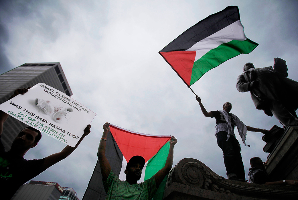 First Place, Student Photographer of the Year - Logan Riely / Ohio UniversityDemonstrators protest to free Gaza and Palestine in front of the Ohio Statehouse.