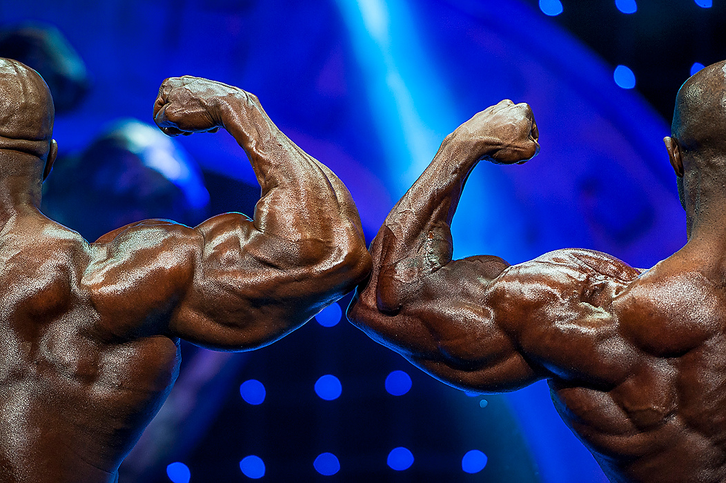 First Place, Student Photographer of the Year - Logan Riely / Ohio UniversityProfessional bodybuilders Cedric McMillian (left) and Brandon Curry (right) show off their back muscles for the judges while on stage at the Veterans Memorial Auditorium in Columbus during the 26th annual IFBB Arnold Classic.