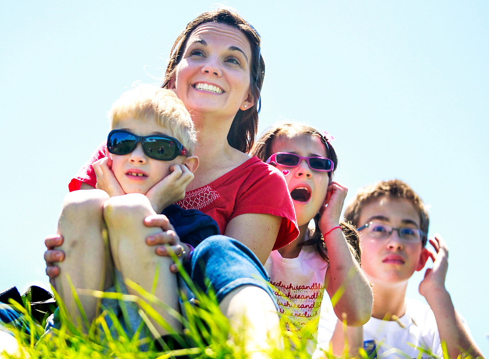 Second Place, Student Photographer of the year - Isaac Hale / Ohio UniversityLeft to right, Samuel Ellis, 7, covers his ears with his hands as his mother, Francine Ellis, holds him as Lydia Ellis, 9, and Joseph Ellis, 11, also cover their ears as a cannon fires during a recreation of July 4, 1813, at Fort Meigs in Perrysburg.