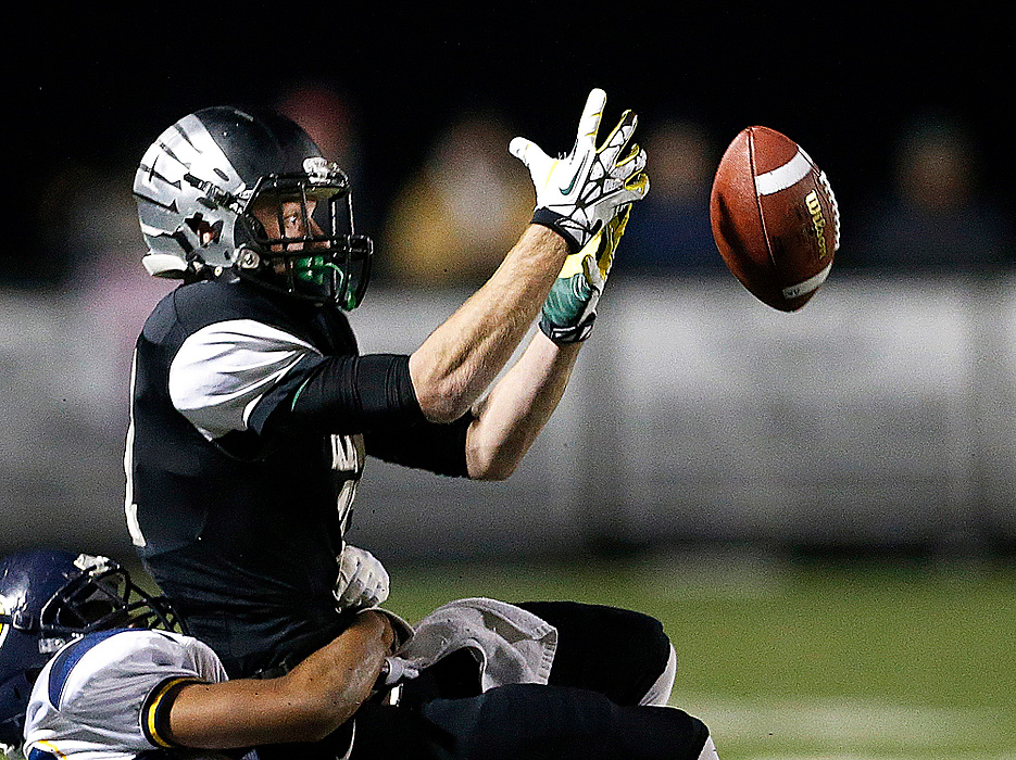 Third Place, Student Photographer of the year - Jenna Watson / Kent State University Westerville Central High School senior Lucas Irwin is unable to receive a pass from senior quarterback Nate Jackowski in the second quarter of play against visiting Solon High School, in Westerville.