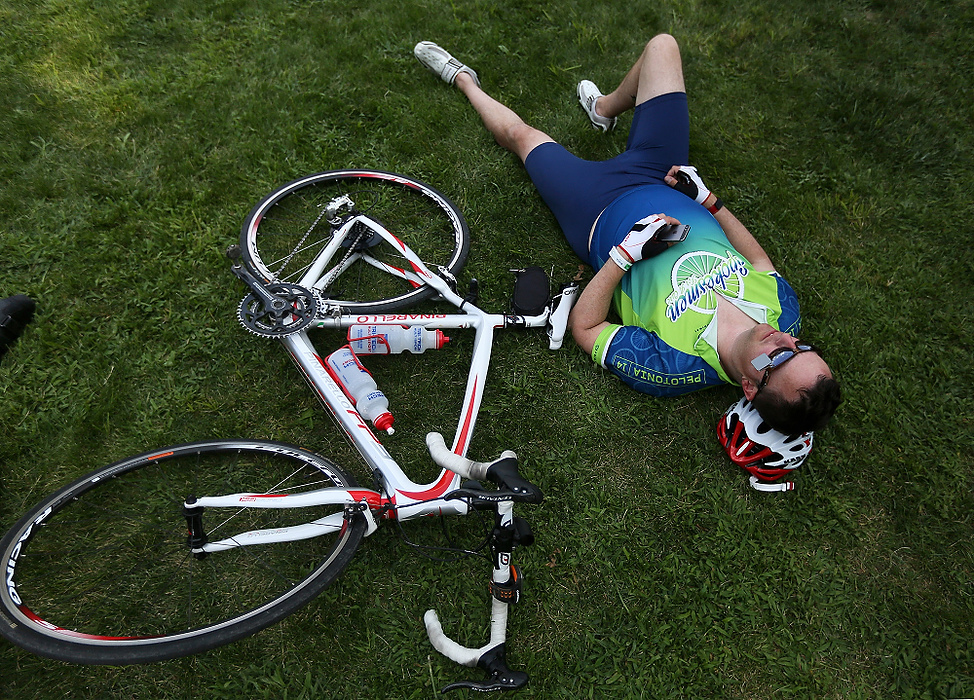 Third Place, Student Photographer of the year - Jenna Watson / Kent State University Brian Howe, of Granville lounges on a hill next to his bike after completing the 100-mile Pelotonia ride in Gambier. 