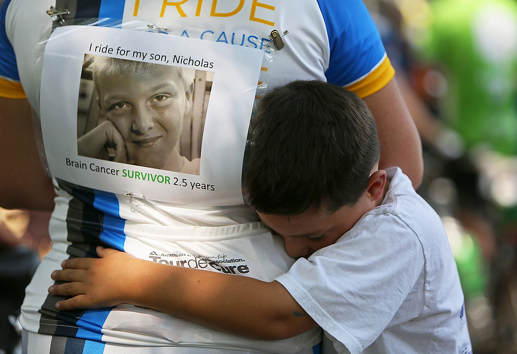 Third Place, Student Photographer of the year - Jenna Watson / Kent State University Matthew Sawchuk, 7, embraces his mother Jennifer, just after she finished the Pelotonia 100-mile ride. Jennifer rode for Matthew's brother, Nicholas Sawchuk, 13, who is a two-and-a-half year survivor of brain cancer. Nicholas and his twin brother Benjamin were present as well. 