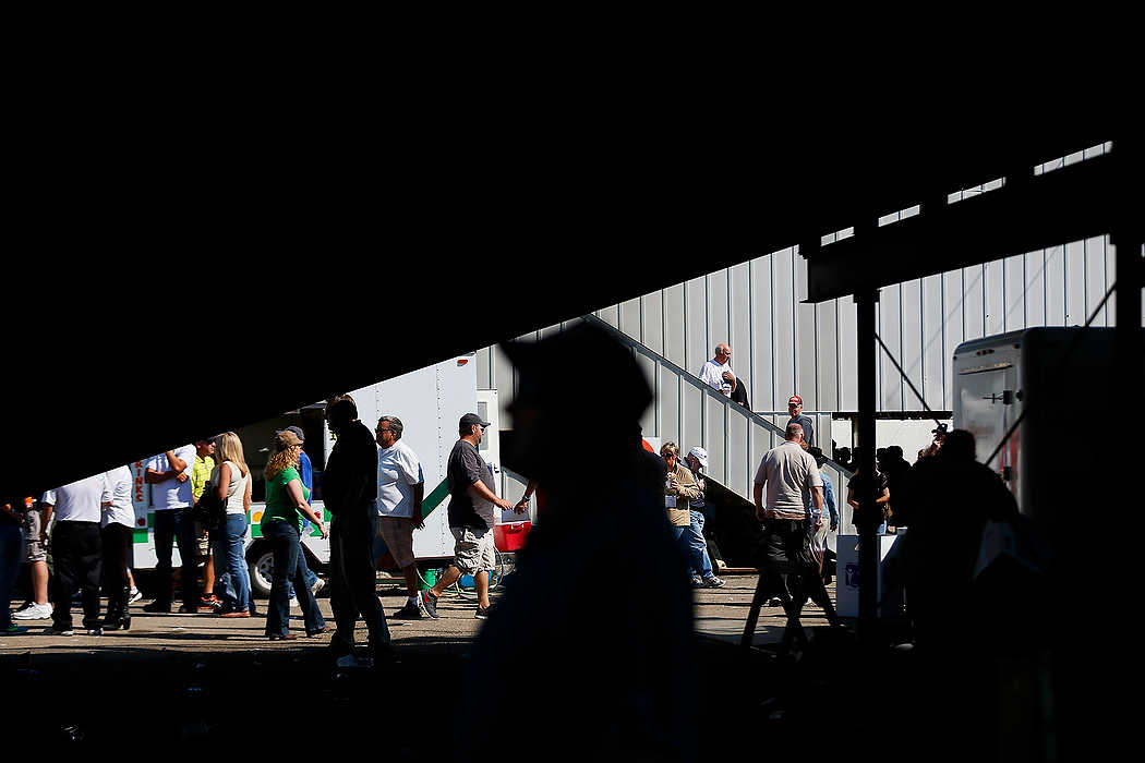 First Place, Sports Picture Story  - Eamon Queeney / The Columbus DispatchHarness racing fans come and go between races during the 69th running of the Little Brown Jug at the Delaware County Fairgrounds.