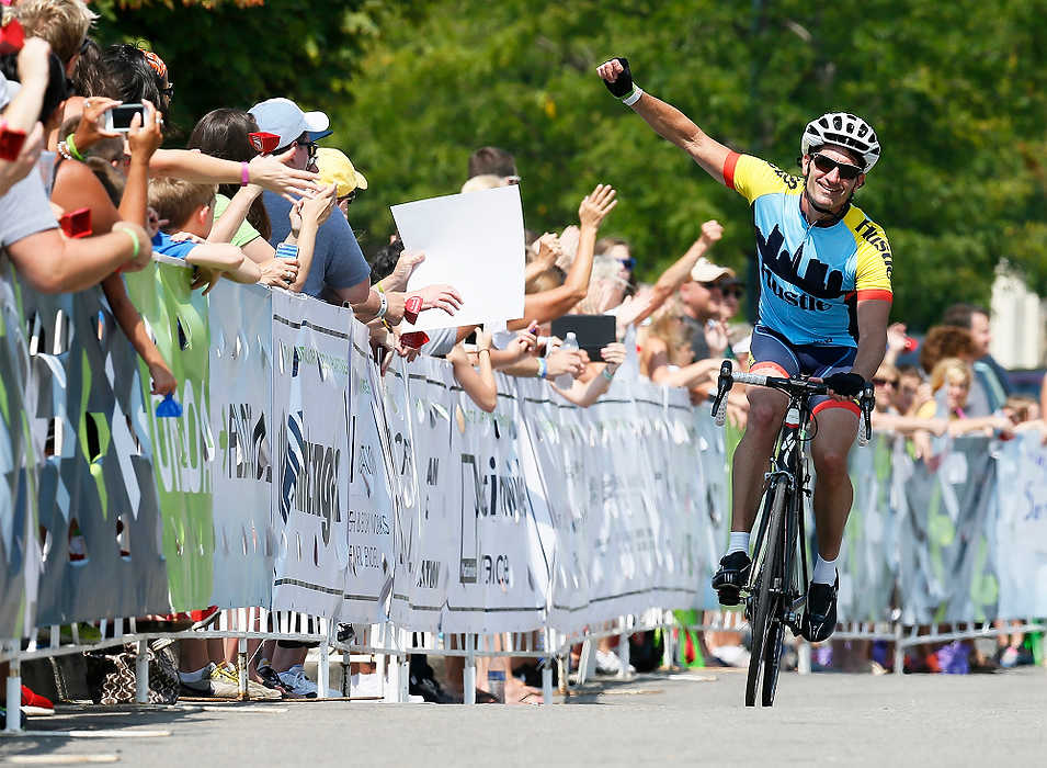 Second Place, Sports Picture Story - Logan Riely / Ohio UniversityRiders celebrate crossing the 180 mile finish line at Market Square in New Albany to end the 6th annual Pelotonia.